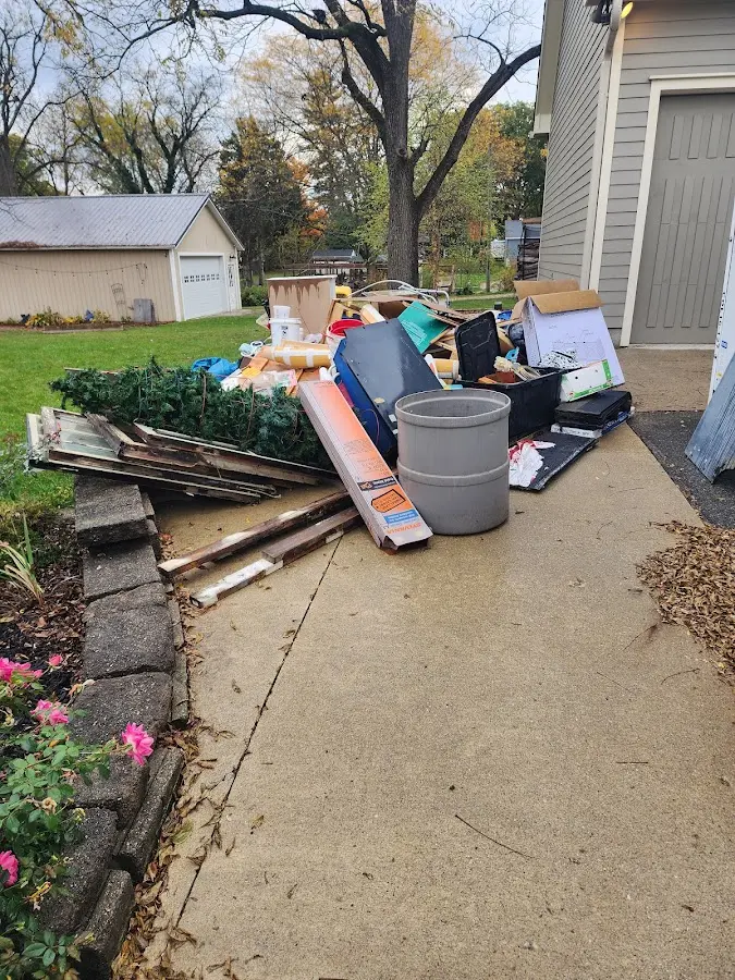 Dumpster being loaded with debris for 3 Yard Dumpster Rental in Cameron Park